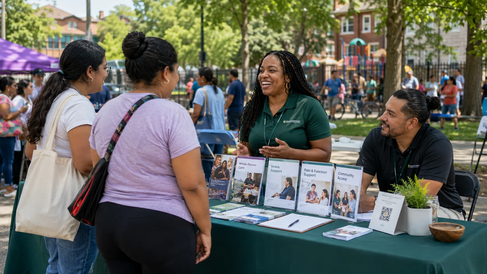InnerVital staff speaking with residents at a neighborhood outreach table